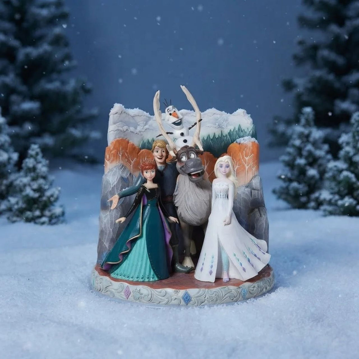 A beautiful piece from the award winning artist Jim Shore. This carved by heart has been hand crafted and hand painted in Jim's unique style and features the firm friends, Elsa, Anna, Olaf, Kristoff and Sven from Frozen 2.