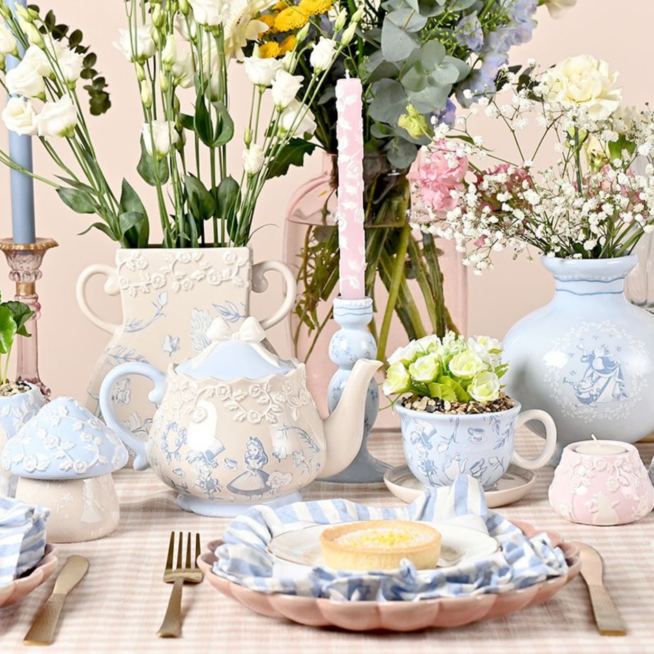 A Disney Alice in Wonderland Teacup Planter with Faux Plant, an officially licensed product that is tailor-made for superfans.