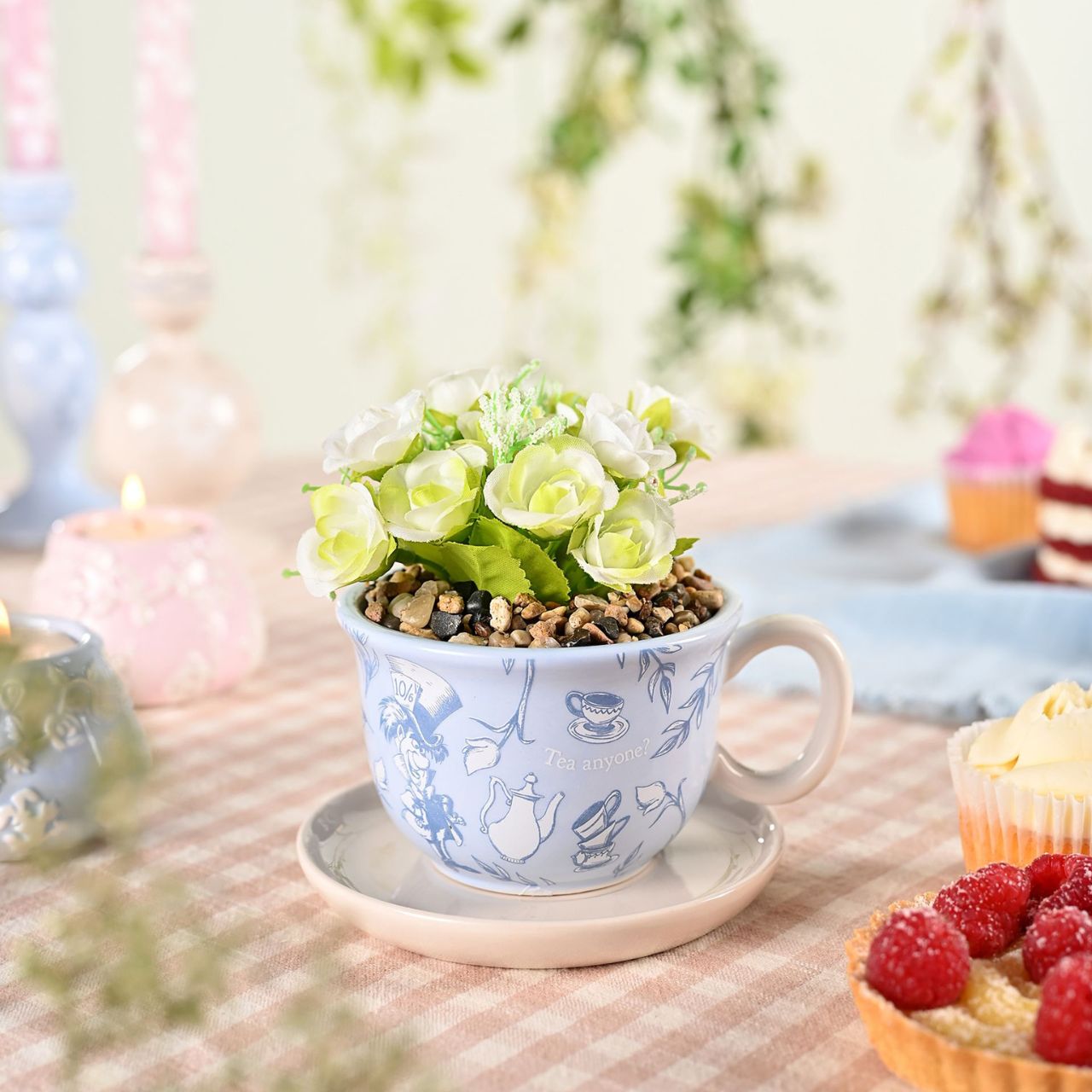 A Disney Alice in Wonderland Teacup Planter with Faux Plant, an officially licensed product that is tailor-made for superfans.