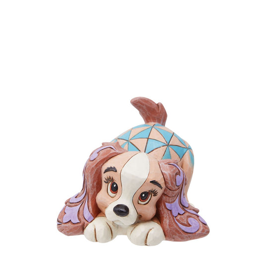 The Disney Traditions collection by Jim Shore brings you an enchanting upgrade of Lady from Lady and the Tramp| This mini animal figurine showcases Lady in a cute and instantly recognizable way, making it an absolutely irresistible addition to your collection.