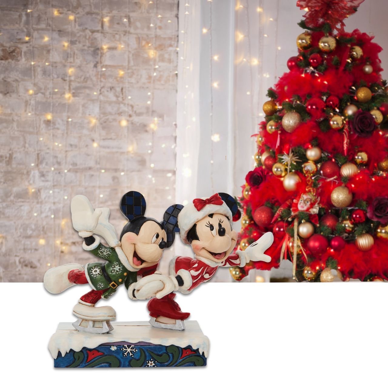 Disney Mickey and Minnie Ice Skating Figurine  Skating together, Mickey and Minnie Mouse warm the winter with their timeless love story. Hand in hand the pair enjoy each other's company in stunning snowflake tunics in this Jim Shore creation.