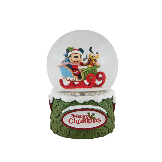 "Laughing All the Way" Make it snow all season long with this exquisitely crafted Disney snow globe by Jim Shore. Mickey plays Santa with his trusty steed, Pluto, riding shotgun. With wide smiles on their faces the pair prepare to deliver presents to all their friends.