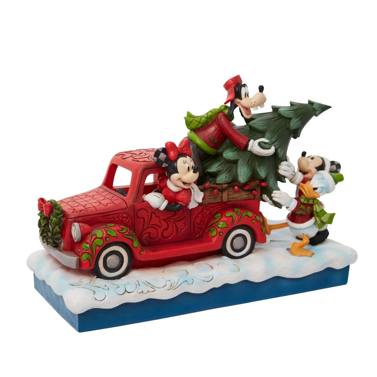 Disney Mickey Mouse and Friends with Red Truck Figurine  Loading a red pick up truck with a freshly picked Christmas tree, Minnie and Mickey Mouse pair up with Donald Duck and Goofy for a wonderful winter spent with friends in this Jim Shore design. The figurine is made from cast stone.