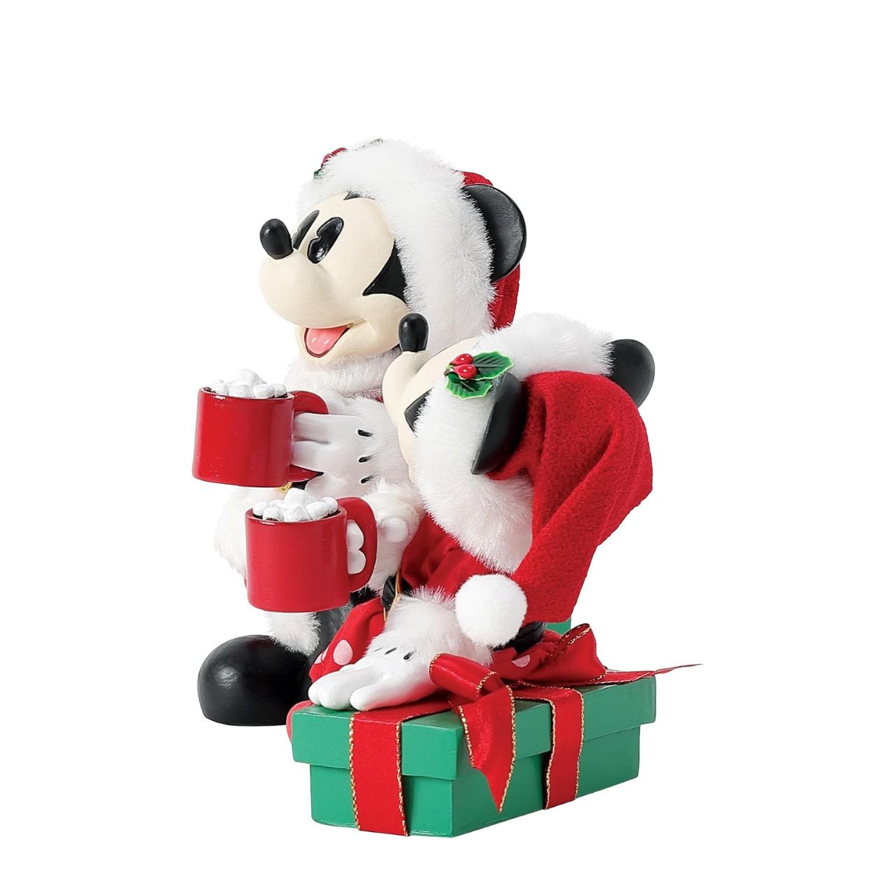 Capture the magic of the season with this charming Department 56 Disney figurine. Mickey and Minnie Mouse are nestled together on festive wrapped gifts, each cradling a steaming mug of hot cocoa—the perfect scene of cosy holiday togetherness.
