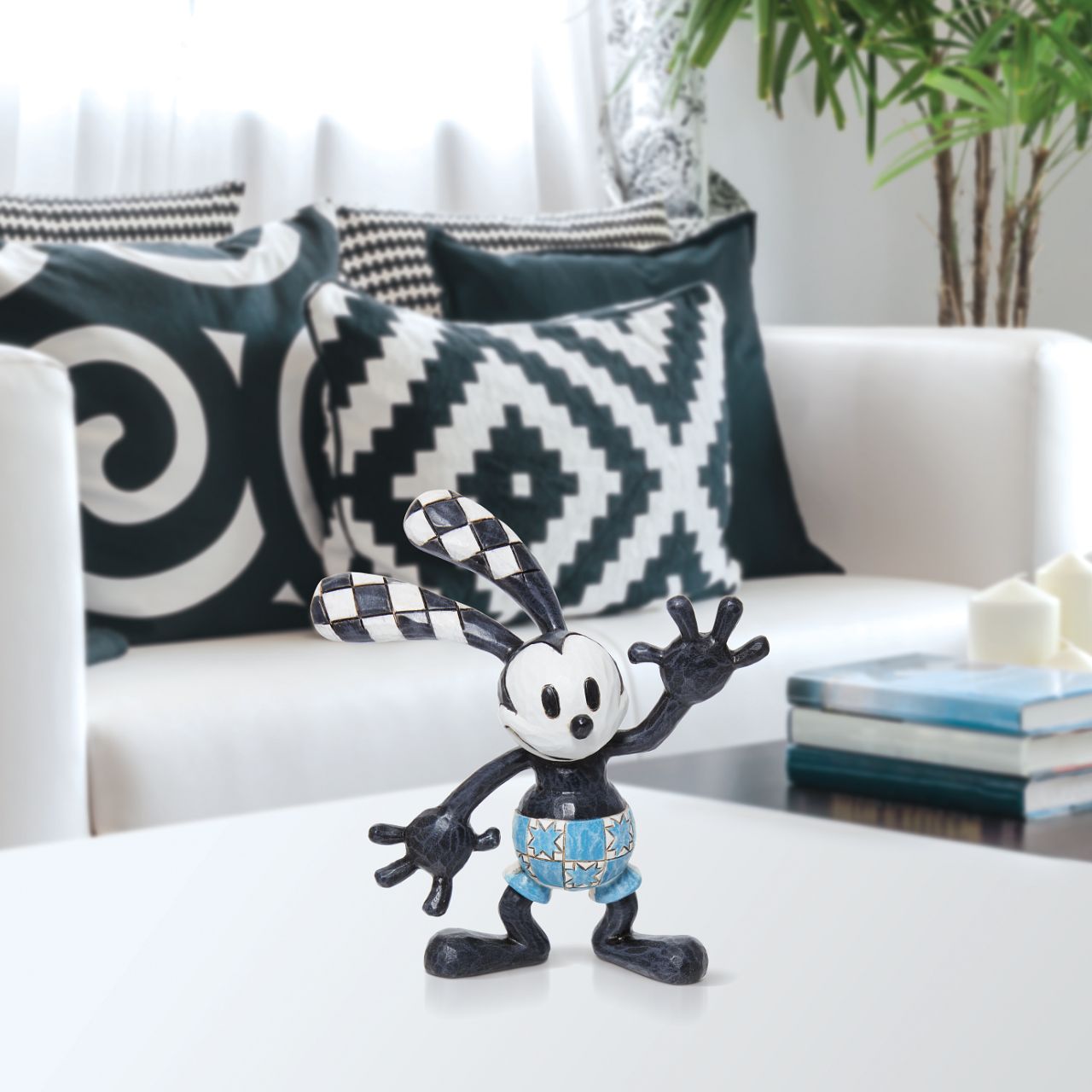 This cute piece of Disney's Oswald has been recreated as a collectible Mini Figurine. Designed by award winning artist Jim Shore, hand crafted using high quality cast stone and hand painted. 