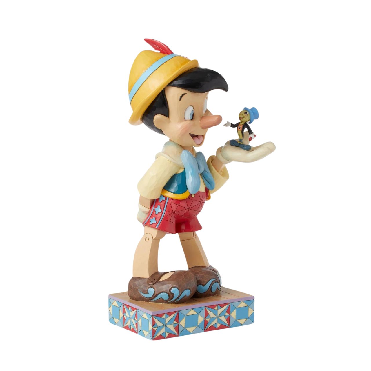 Disney's Pinocchio is the size of a real boy with this figurine. Hand carved and painted, this piece comes from the Disney Traditions collection by Jim Shore. This impressive piece comes packaged in a fully branded gift box.