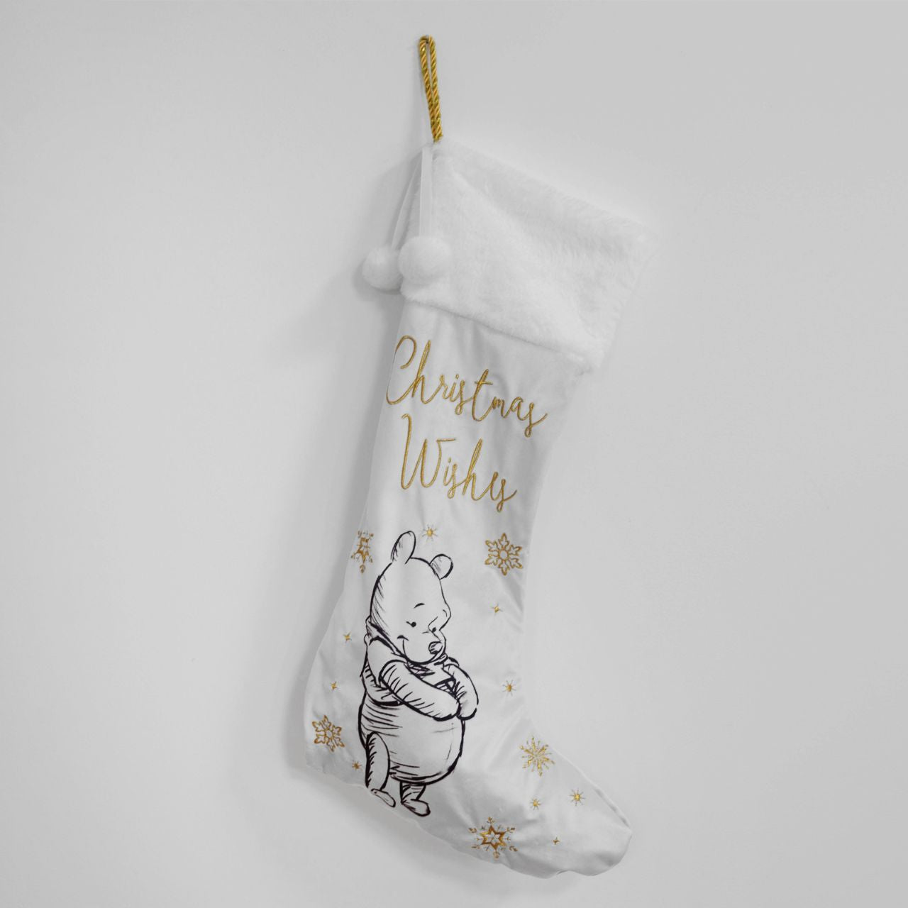 Disney Winnie The Pooh Plush Velvet Stocking  Give Santa the perfect place to leave those gifts with this beautiful white velveteen Winnie The Pooh stocking with gold embroidery. From Disney Classic Collectables - luxurious collectable gifts for the enduring Disney fan.