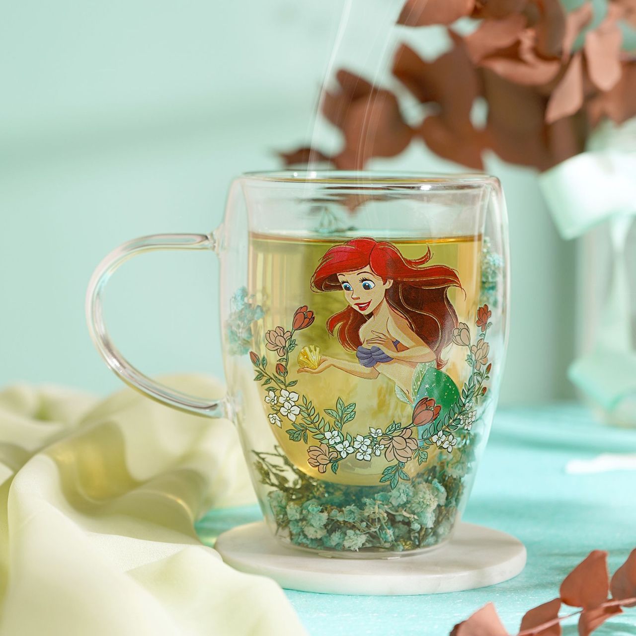 Step into the enchanting world of Disney with the Disney Pastel Princess Glass Mug - Ariel.