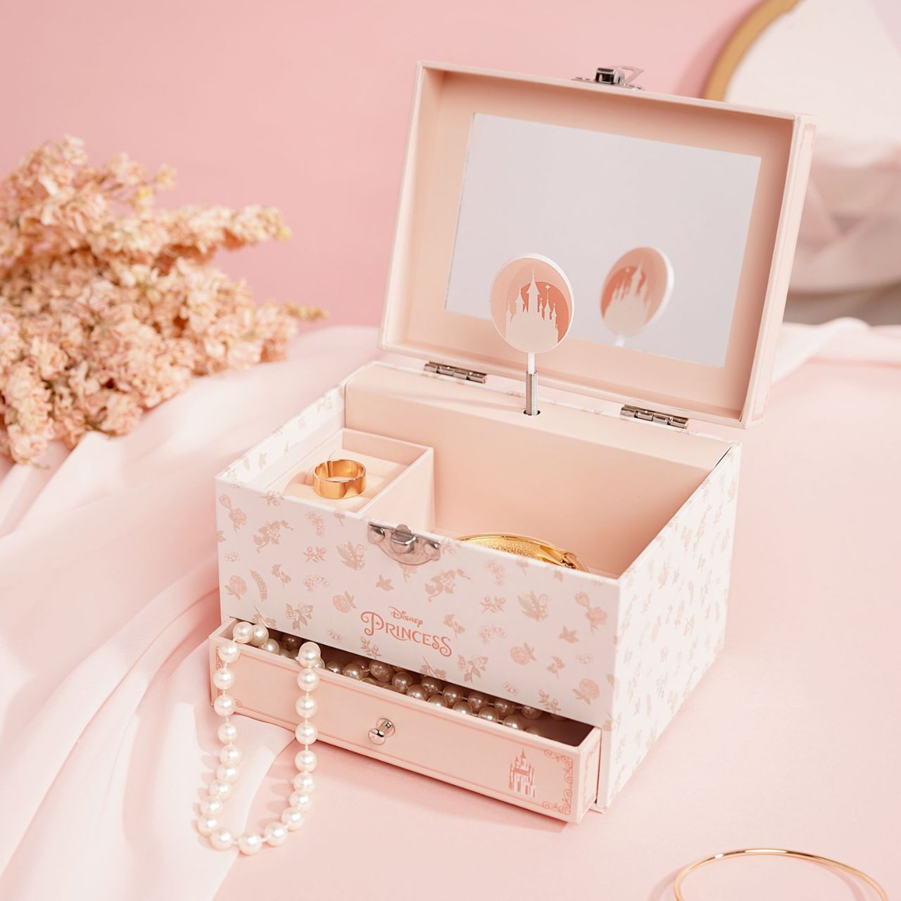 This enchanting jewellery box, adorned with a floral pattern, is a perfect spot for storing treasured trinkets. With a drawer for small keepsakes and a cheery tune that plays when opened, its an ideal gift for Disney princess enthusiasts of all ages.