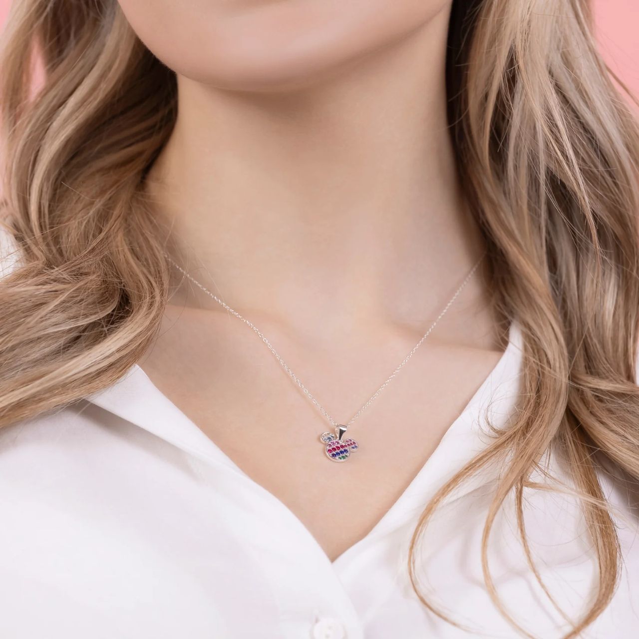 This Disney Sterling Silver Diagonal Nano Rainbow Pave Mickey Mouse 18" Necklace features a dazzling, colourful design that sparkles in the light. Made from high-quality sterling silver, this necklace is sure to add a touch of magic to any outfit. Perfect for Disney fans of all ages.