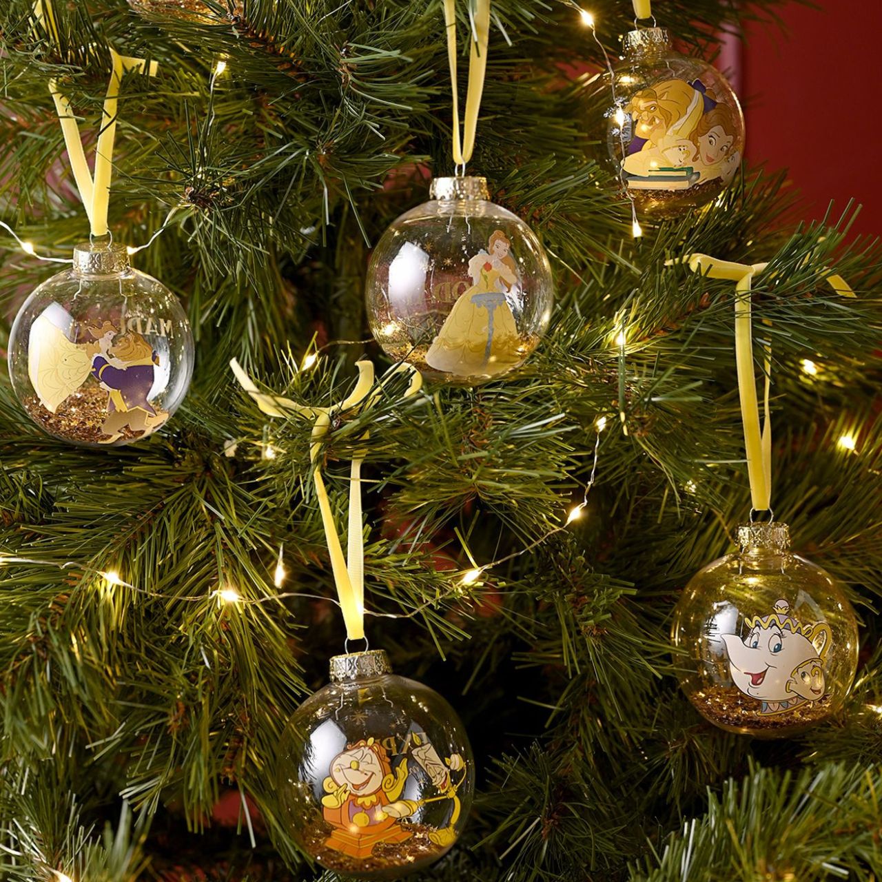 Make Christmas sparkle with this magical set of seven glass baubles featuring beloved characters from Disney's Beauty and the Beast. This set brings the enchanting tale to life with Belle, Beast, Lumiere, Mrs. Potts and others, adorning the delicate ornaments.