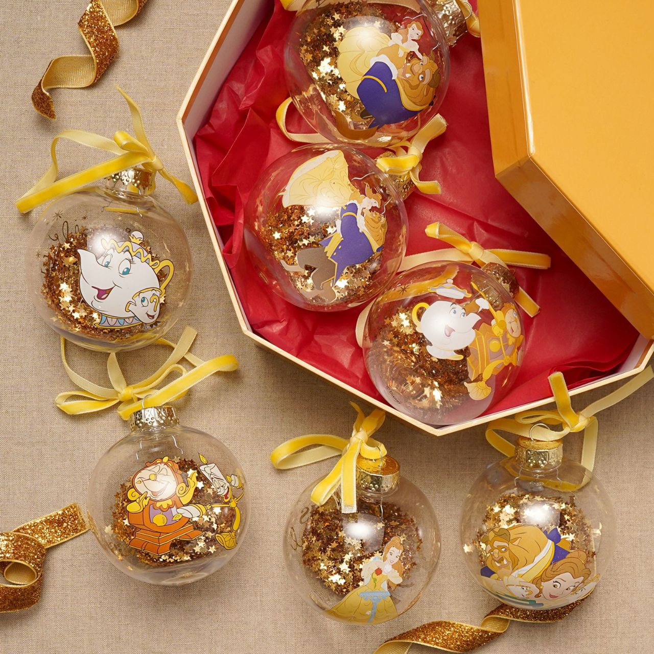 Make Christmas sparkle with this magical set of seven glass baubles featuring beloved characters from Disney's Beauty and the Beast. This set brings the enchanting tale to life with Belle, Beast, Lumiere, Mrs. Potts and others, adorning the delicate ornaments.