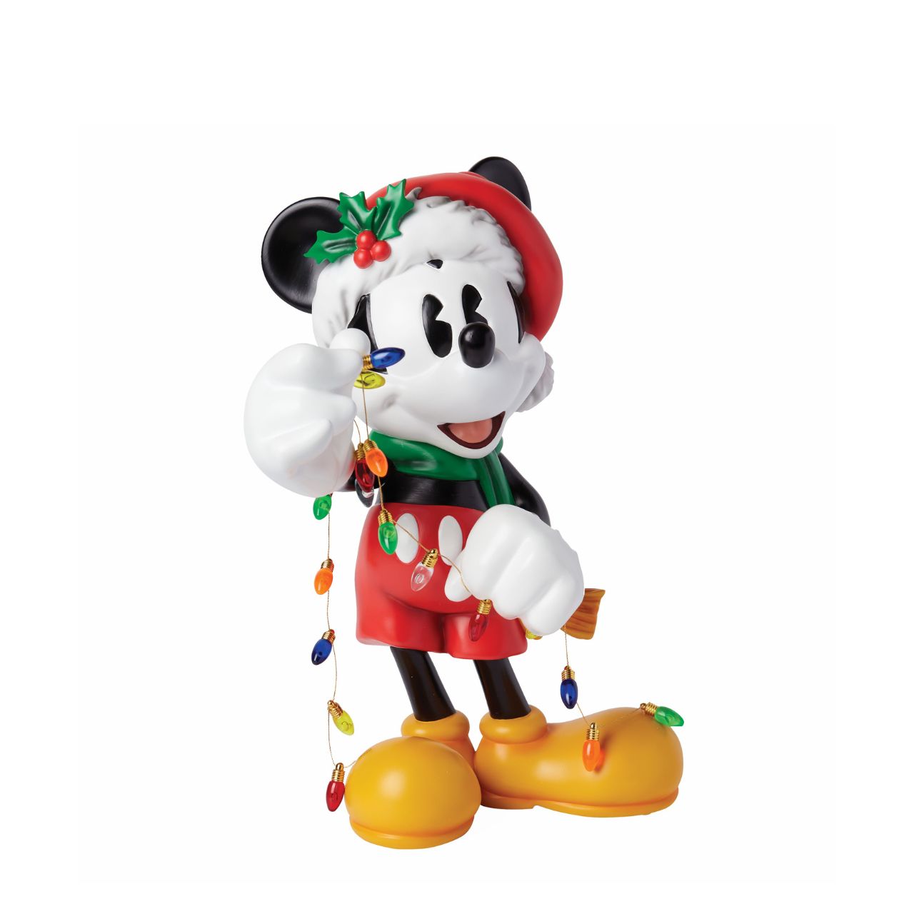The Holiday Mickey Figurine by Disney Showcase is a fantastic gift for lovers of Disney's iconic mouse. Standing over 30cm tall and dressed in his festive outfit whilst holding a string of Christmas lights, this Mickey figurine is a delightful display piece that will be admired by all those who see it. 
