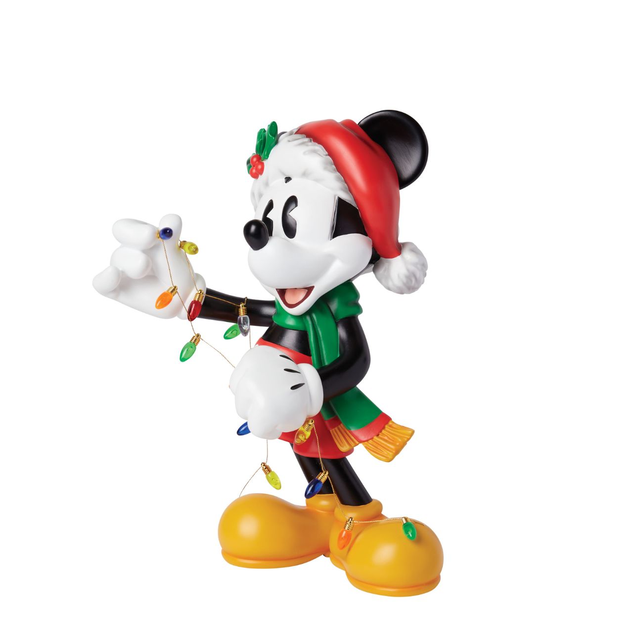 The Holiday Mickey Figurine by Disney Showcase is a fantastic gift for lovers of Disney's iconic mouse. Standing over 30cm tall and dressed in his festive outfit whilst holding a string of Christmas lights, this Mickey figurine is a delightful display piece that will be admired by all those who see it. 