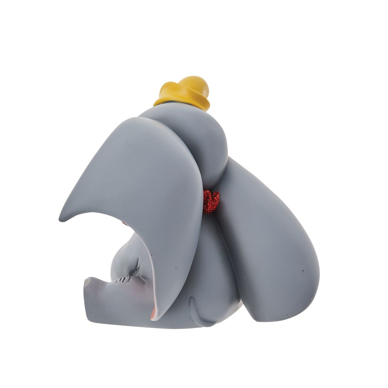 Everyone's favourite flying elephant looks circus-ready in this adorable pose by Disney Showcase. This realistic figurine has a beautiful finish complete with red glitter. This is a great addition to any nursery and is not a toy or children's product.