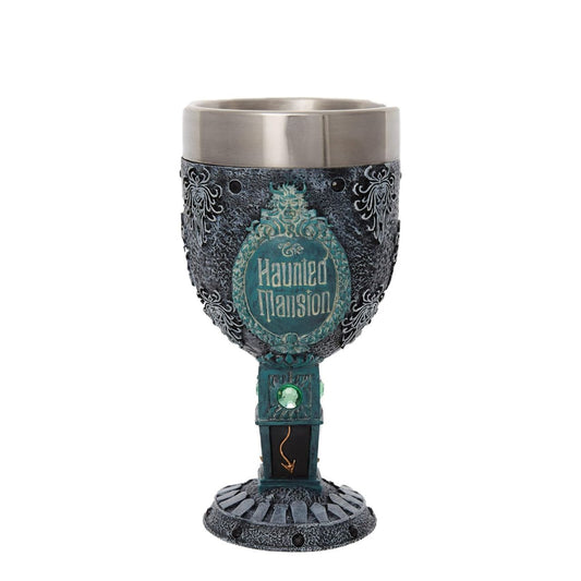 Haunted Mansion Decorative Goblet by Disney Showcase  The Haunted Mansion Goblet is adorned with black gems around the top and the base, creating a beautifully spooky statement piece. It features a clock design on the stem, a bat on the body of the piece and gravestones wrapped around the base, all inspired by the iconic Haunted Mansion ride