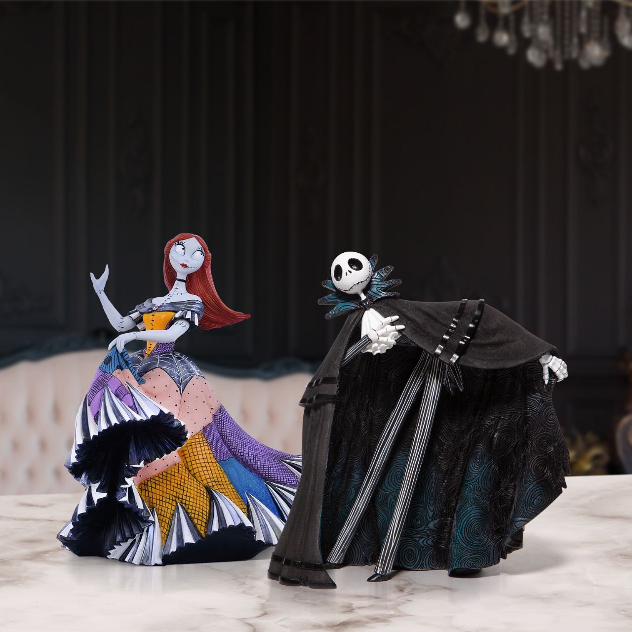 Disney Showcase Nightmare Before Christmas Sally Figurine  Sally from Tim Burton's The Nightmare Before Christmas has updated her rag doll dress into a stunning gown for the Halloween Ball. Hand painted by skilled artisans, Sally shines with iridescent paint and faux gem stones.