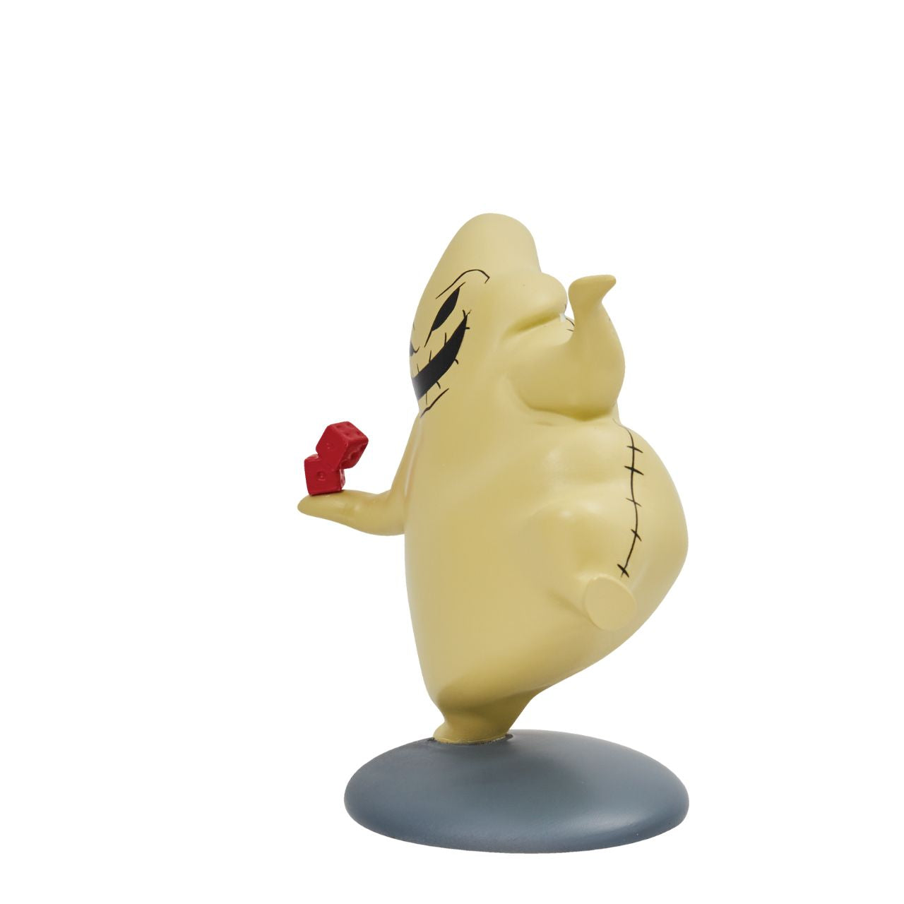 This mini Oogie Boogie figurine is the perfect gift for any Nightmare Before Christmas fans. With his red dice and pointy sack body, this villain is a great addition to any collection. Ideal for Halloween, birthdays or as just a little treat.
