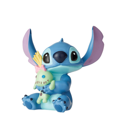 Disney Showcase Stitch Doll Figurine  Irresistibly adorable, this little Stitch will make you want to give your best friend the same tight squeeze he's giving his doll. 'Ohana means family, make him a part of yours.