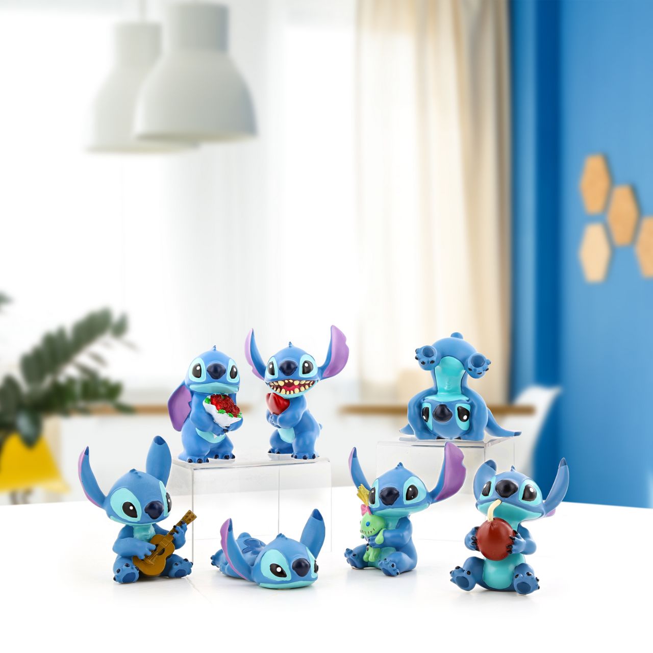 Stitch Guitar Figurine Disney Showcase  Here to play you your favourite tune, Lilo's best friend Stitch will turn any frown upside down. With perked ears and a sweet smile, this little guy will help your mind drift away to Hawaiian paradise.