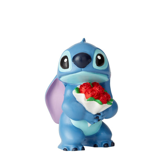 Disney Showcase Stitch Flowers Figurine  Don't fret, Stich. Of course we forgive you. How can you resist such a cute face? Lilo taught Stitch to love and he's here to say "I love you, too." 