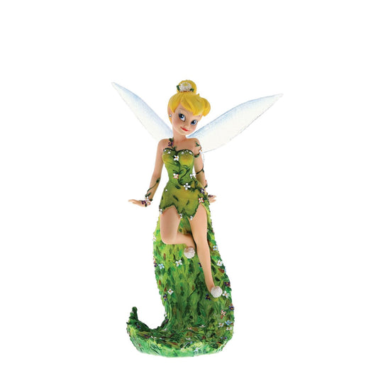 Tinker Bell pulls out all the stops in this high fashion figurine from our Haute Couture Collection. Delicate vines of flowers encircle her arms and dress and cover her dramatic, floor-sweeping train.