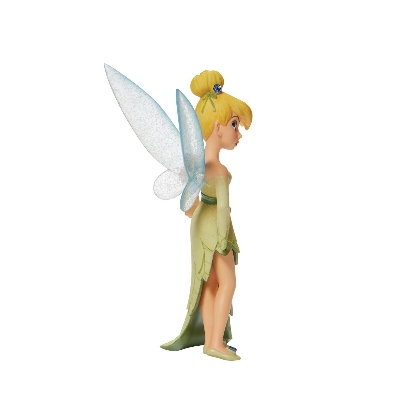 Hands on her hips, this pixie pouts with elegance and charm. With sparkling fairy wings and bedazzled accents, this Disney collectible is a tiny treasure. Wearing a dress made from the finest leaves, Tinker Bell is the unofficial queen of Neverland.