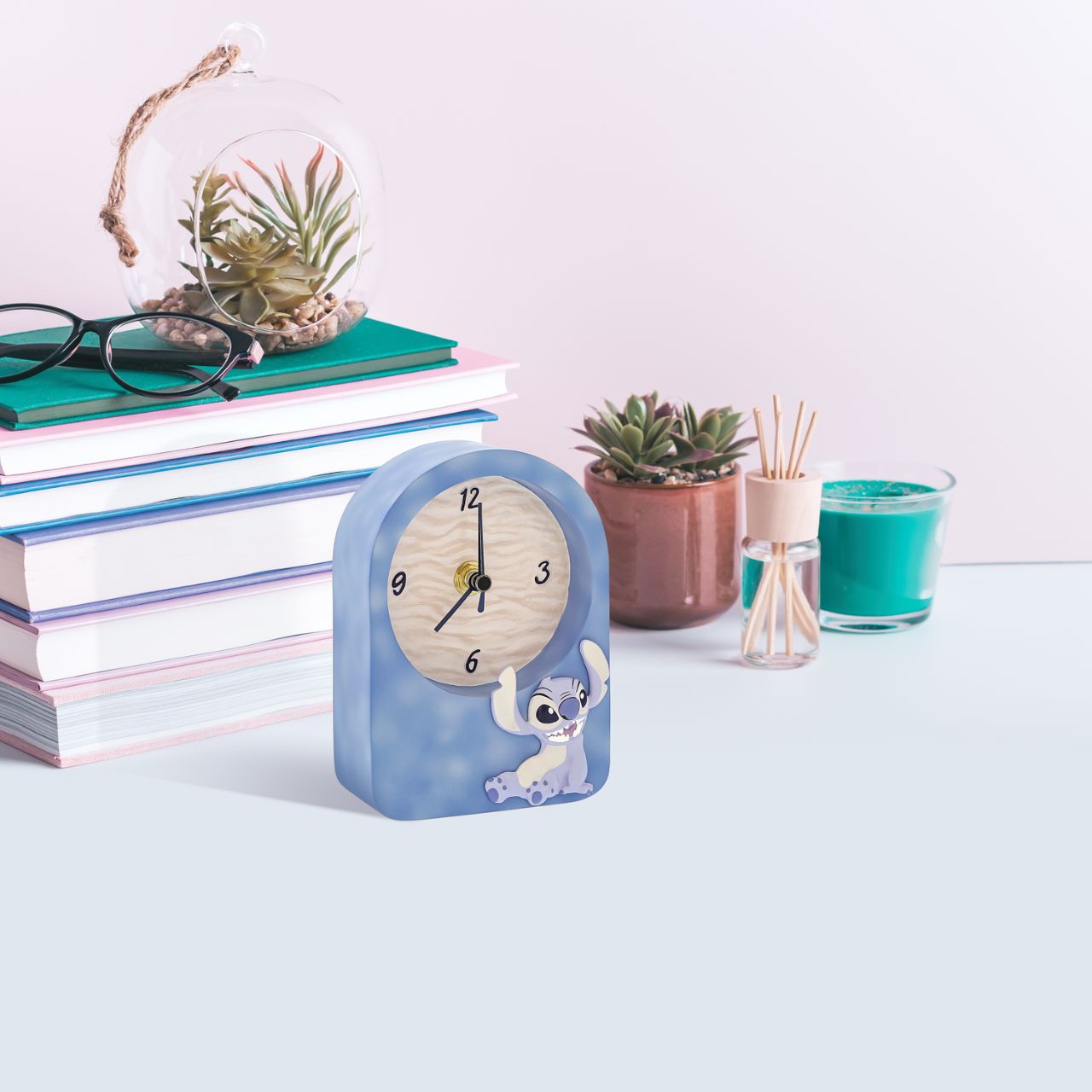 Tick-tock in Disney style. Introducing the Stitch Desk Clock-embossed with Stitch's charm on the front. This adorable timepiece brings playful energy to your workspace. Let Stitch keep you company as you navigate your day, adding a dash of Disney magic to every hour.