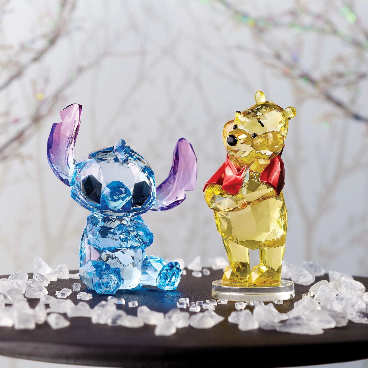 Disney Stitch Facets Figurine  This "gem cut" acrylic sculpture reflects Stitch's sparkling personality and childlike charm. Presented in a branded window gift box. Not a toy or children's product. Intended for adults only.