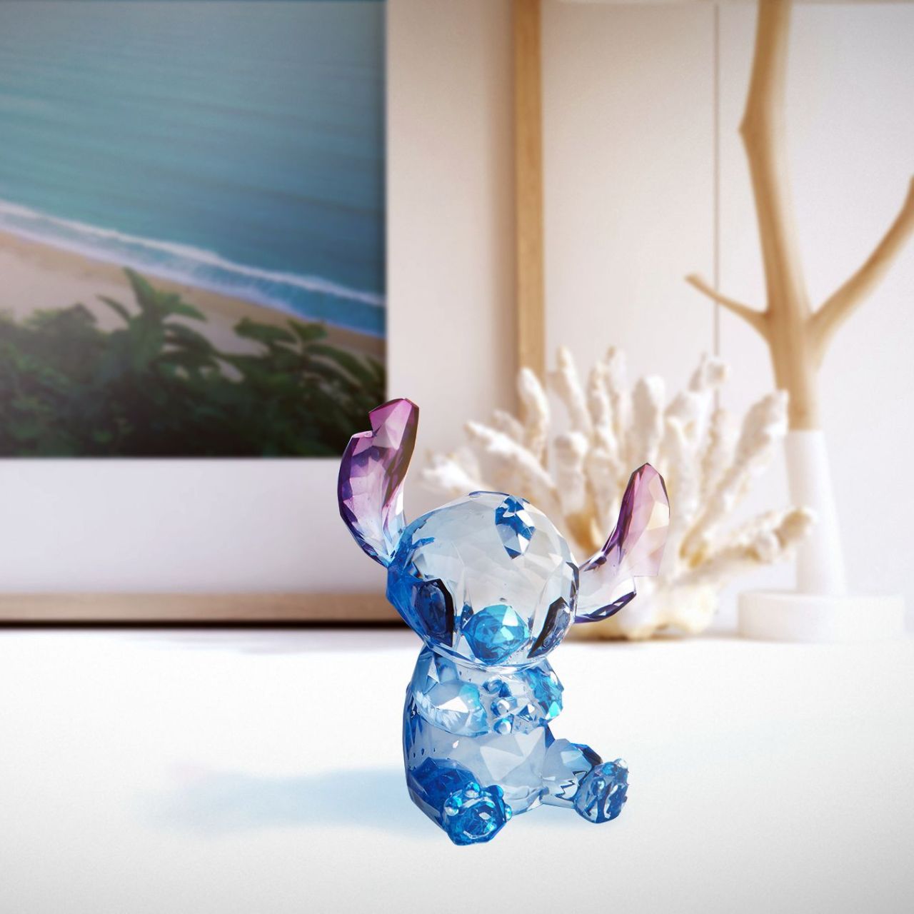 Disney Stitch Facets Figurine  This "gem cut" acrylic sculpture reflects Stitch's sparkling personality and childlike charm. Presented in a branded window gift box. Not a toy or children's product. Intended for adults only.