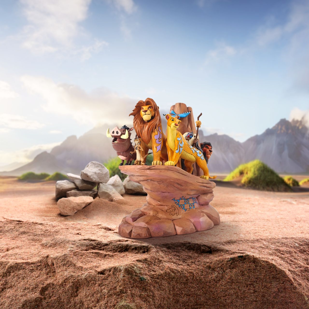 This incredible creation by Jim Shore celebrates the 30th anniversary of Disney's beloved 1994 film, The Lion King. With patchwork patterning and Rafiki's Simba drawing, Pride Rock looks stately as the main characters stand upon the stage.