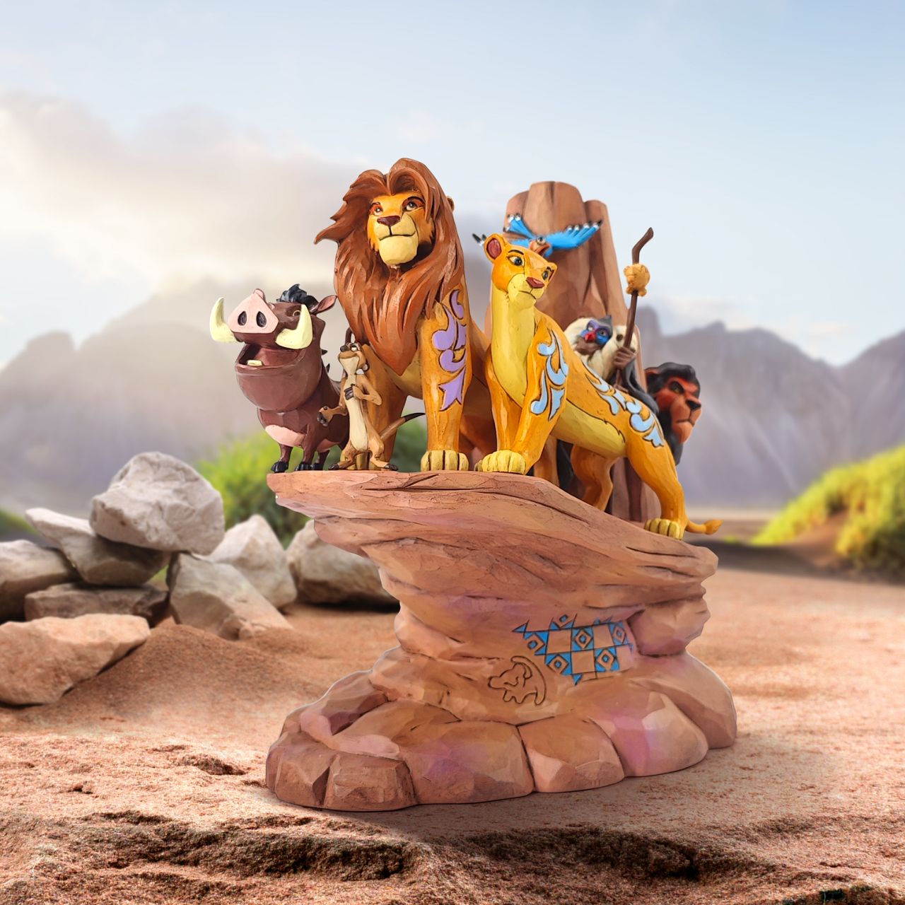 This incredible creation by Jim Shore celebrates the 30th anniversary of Disney's beloved 1994 film, The Lion King. With patchwork patterning and Rafiki's Simba drawing, Pride Rock looks stately as the main characters stand upon the stage.