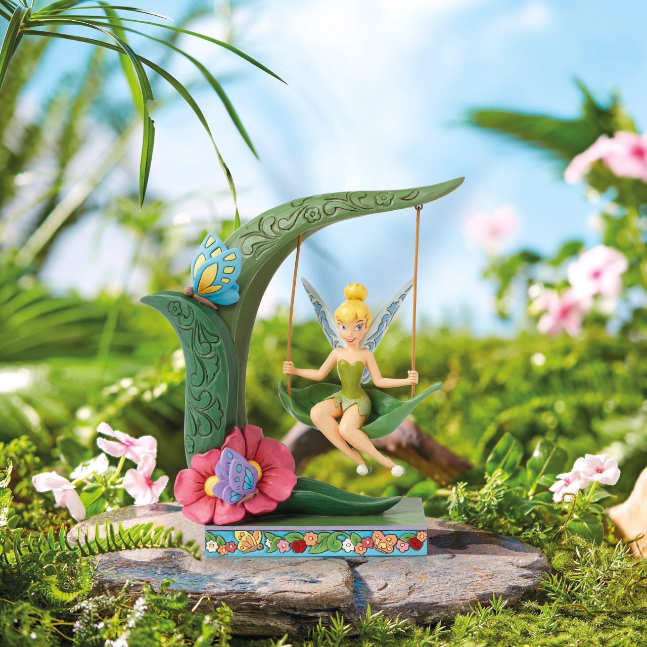 This magical piece features Disney's Tinker Bell playing on a flowery spring. The iconic pixie from Peter Pan is enjoying herself on this sweet spring themed figurine as part of the Disney Traditions collection by Jim Shore.