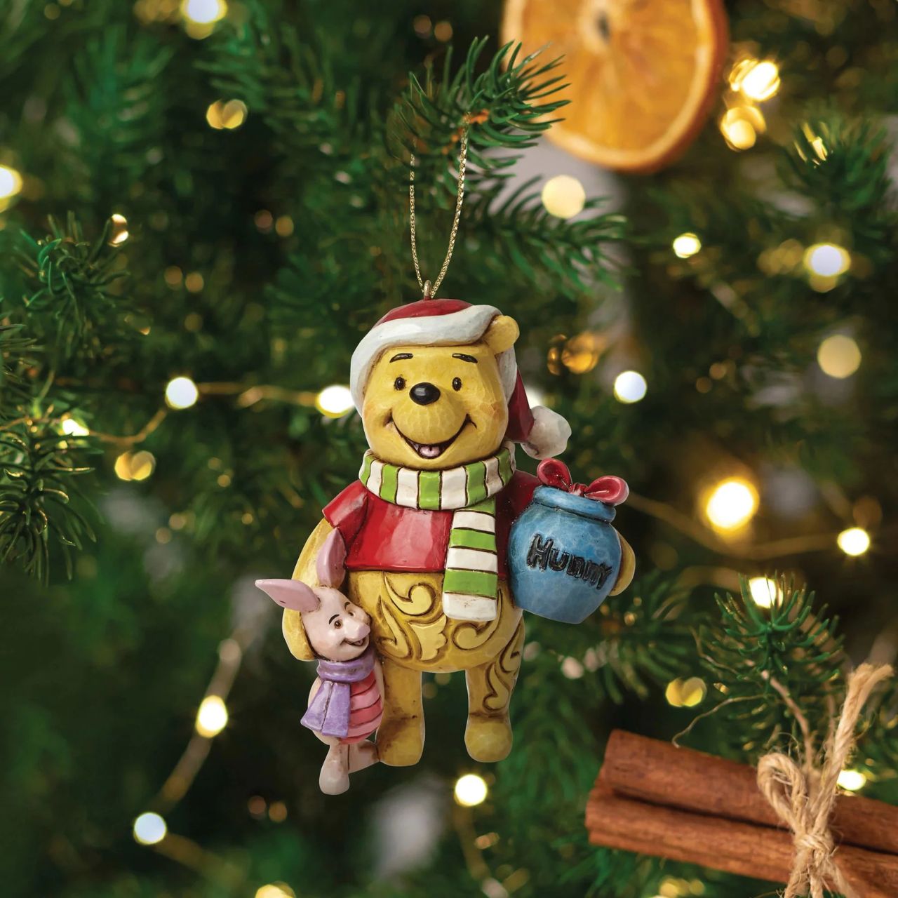 Add some friendship to your Christmas tree this season with Winnie the Pooh and Piglet. Designed by award-winning artist and sculptor Jim Shore. The hanging ornament is made from cast stone. Product is supplied in branded gift packaging.