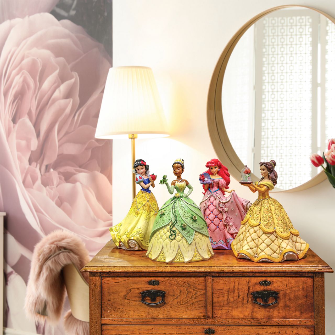 First in a Series of Deluxe figurines (The Enchanted Princess Series.) Designed by Jim Shore in celebration of Beauty and the Beast's 30th Anniversary is this striking 38.0cm Belle figurine, Belle looks stunning in her characteristic golden ball gown, embellished with pearls and swarovski crystals.