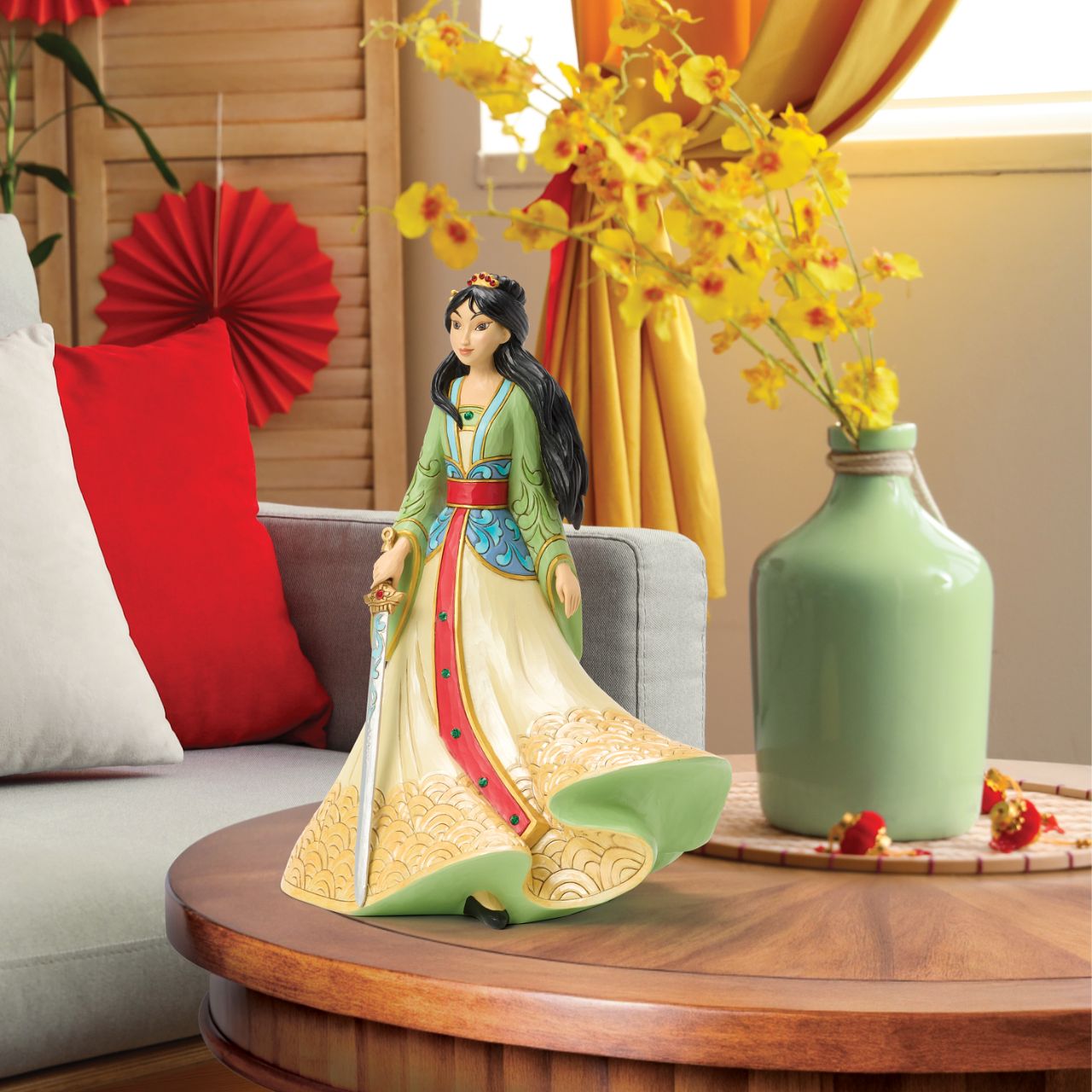 This exquisite Jim Shore deluxe princess bust showcases Mulan in her finest dress, carrying a sword with bravery and strength. With traditional makeup and cherished Chinese symbols, she captivates with beauty, legacy, and courage.