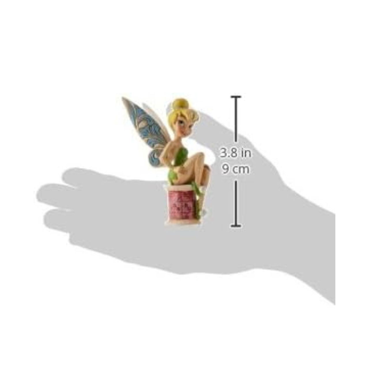 Tinker Bell takes a rest on a tiny spool of thread. Great for Tink lovers, Jim Shore collectors and sewing enthusiasts alike. A fun and flirty new personality pose from award winning artist and sculptor, Jim Shore. The figurine is made from cast stone. Packed in a branded gift box.