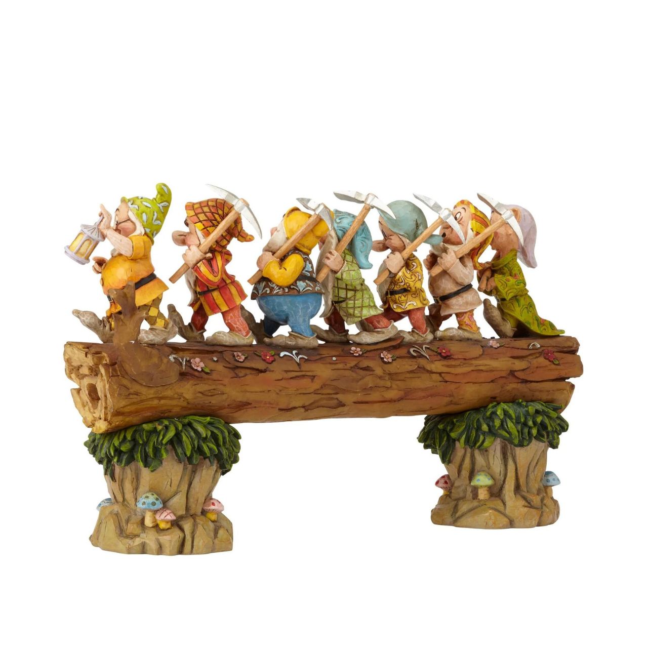 Homeward Bound captures a very memorable scene from the classic Snow White animation; the lovable 7 Dwarfs return home to find an unexpected house guest: a sleeping Princess. Designed by award winning artist and sculptor, Jim Shore for the Disney Traditions brand. The figurine is made from cast stone.