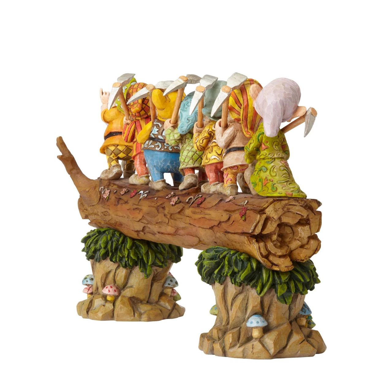 Homeward Bound captures a very memorable scene from the classic Snow White animation; the lovable 7 Dwarfs return home to find an unexpected house guest: a sleeping Princess. Designed by award winning artist and sculptor, Jim Shore for the Disney Traditions brand. The figurine is made from cast stone.