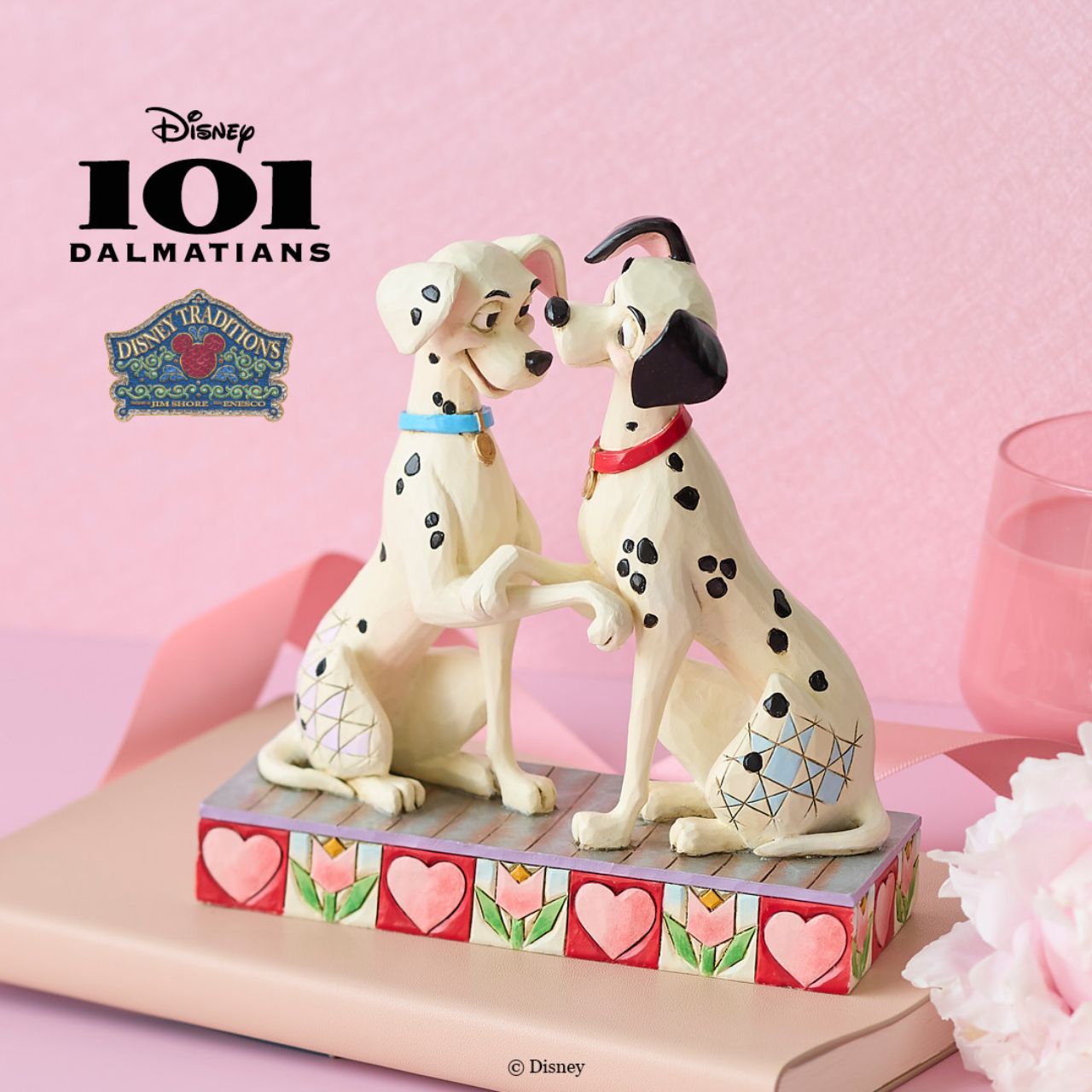 Disney's Pongo and Perdita from 101 Dalmatians show their puppy love in this sweet piece from the Disney Traditions by Jim Shore collection. Hand crafted and painted, this piece is perfect for Valentines Day, engagements, weddings and anniversaries.