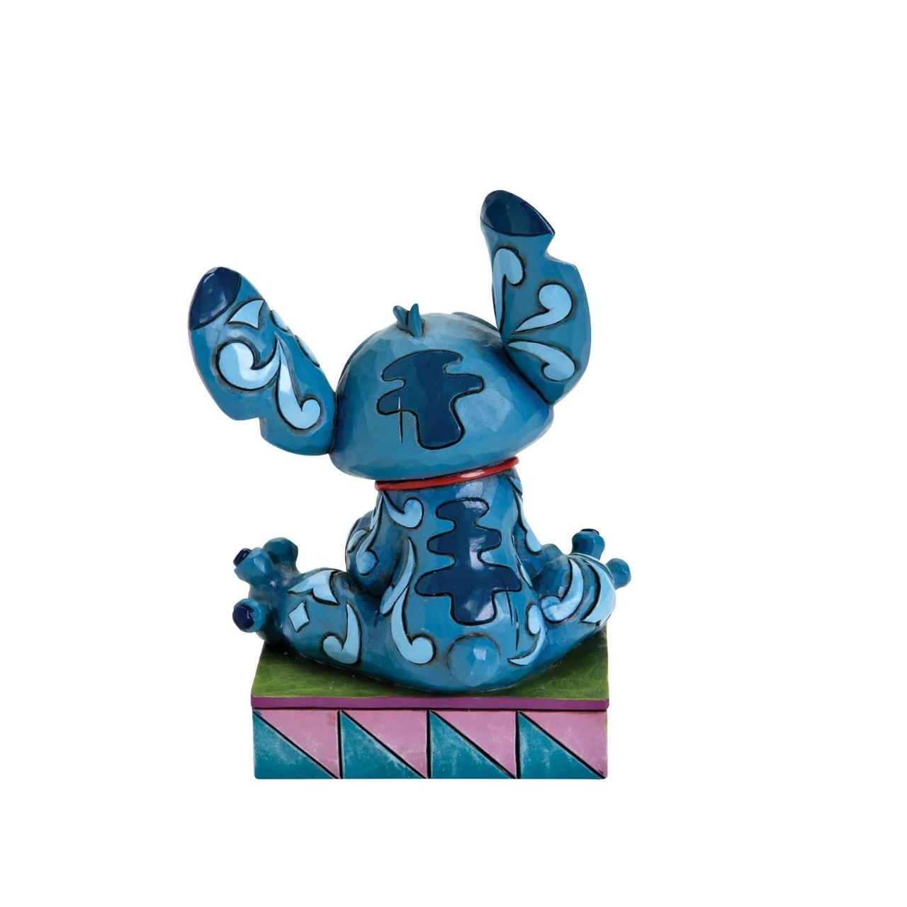 Disney Traditions Stitch Ohana Means Family  Designed by award winning artist and sculptor, Jim Shore for the Disney Traditions brand, this Stitch figurine is a part of a personality poses collection. He is featured displaying his typical mischievous smile.