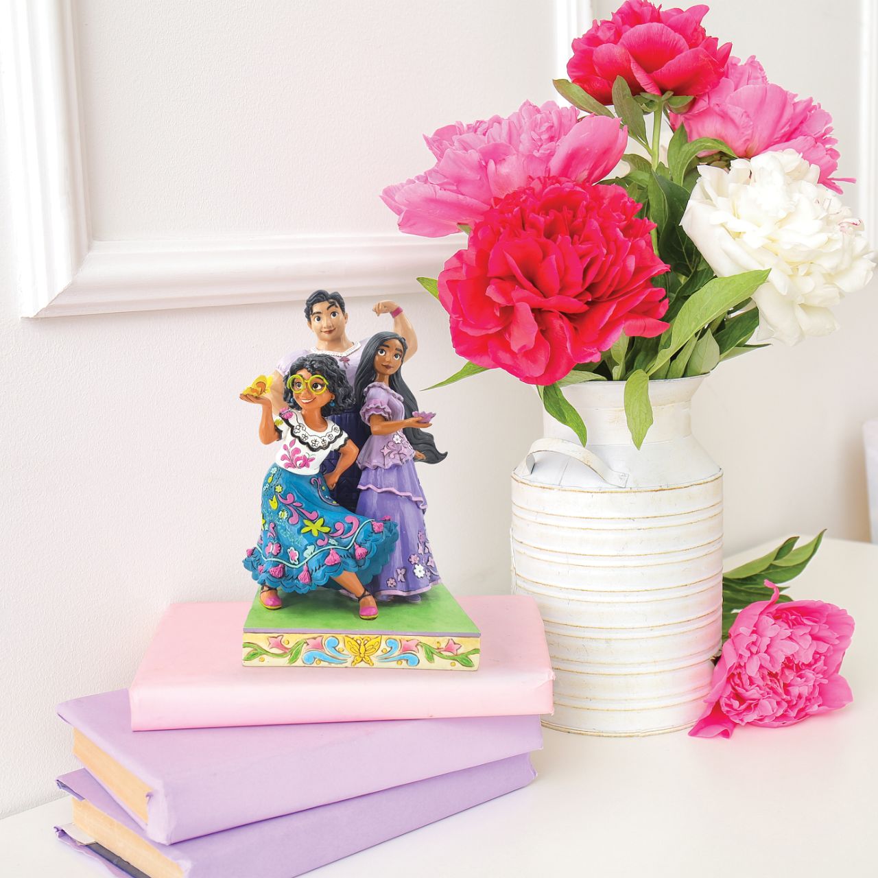 Life is full of colour and everyone has a gift. This special figurine features Mirabel, Isabella and Luisa from the hit Disney film, Encanto. The three sisters showing that they are truly "Stronger Together".