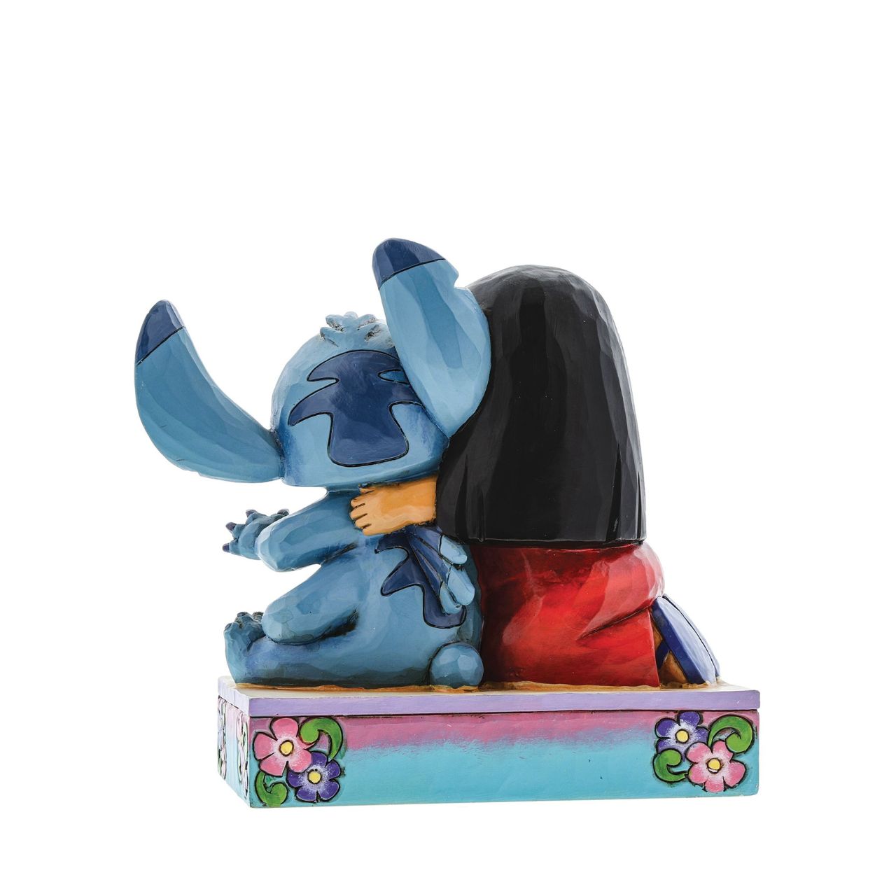 Jim Shore Ohana Means Family Lilo and Stitch Figurine  Lilo and Stitch come together in an exemplary display of Ohana which means family. This heart-warming piece has been designed by award winning artist and sculptor, Jim Shore for the Disney Traditions range.