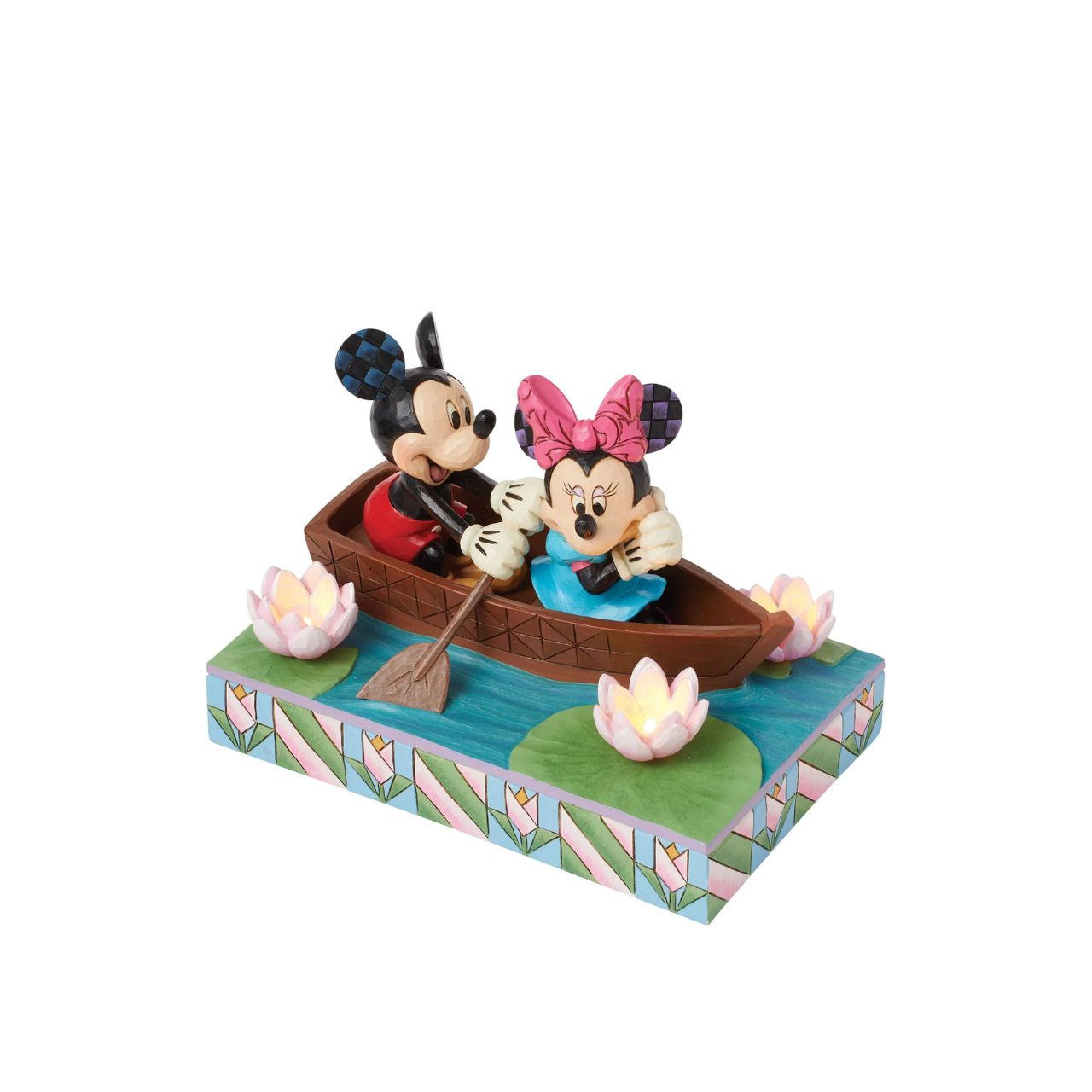 Disneys Mickey and Minnie Mouse are sailing on love in this sweet, light-up figurine from the Disney Traditions by Jim Shore.