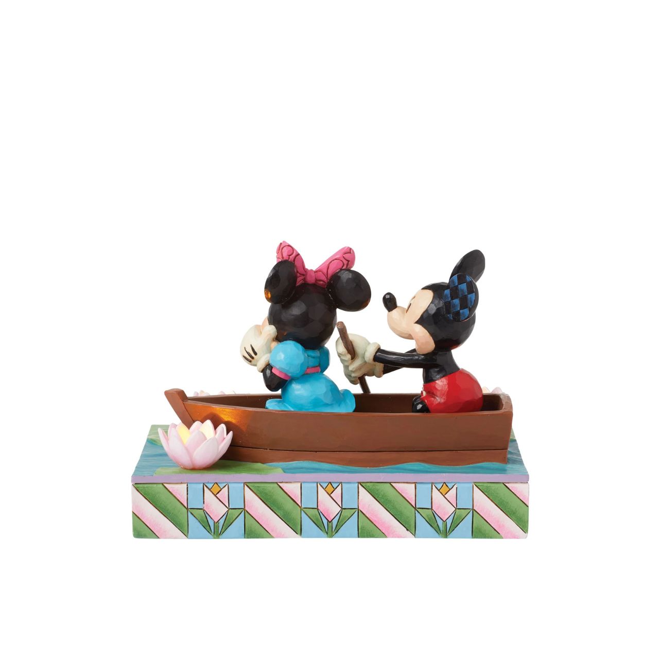 Disneys Mickey and Minnie Mouse are sailing on love in this sweet, light-up figurine from the Disney Traditions by Jim Shore.