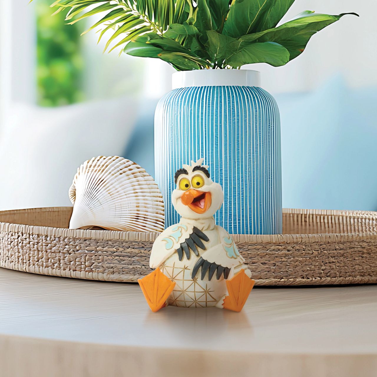 This Jim Shore miniature features Scuttle, the eccentric Seagull from The Little Mermaid, with vibrant rosemaling and charming patchwork details. With a bright smile and playful expression, you can almost hear his joyful laugh.