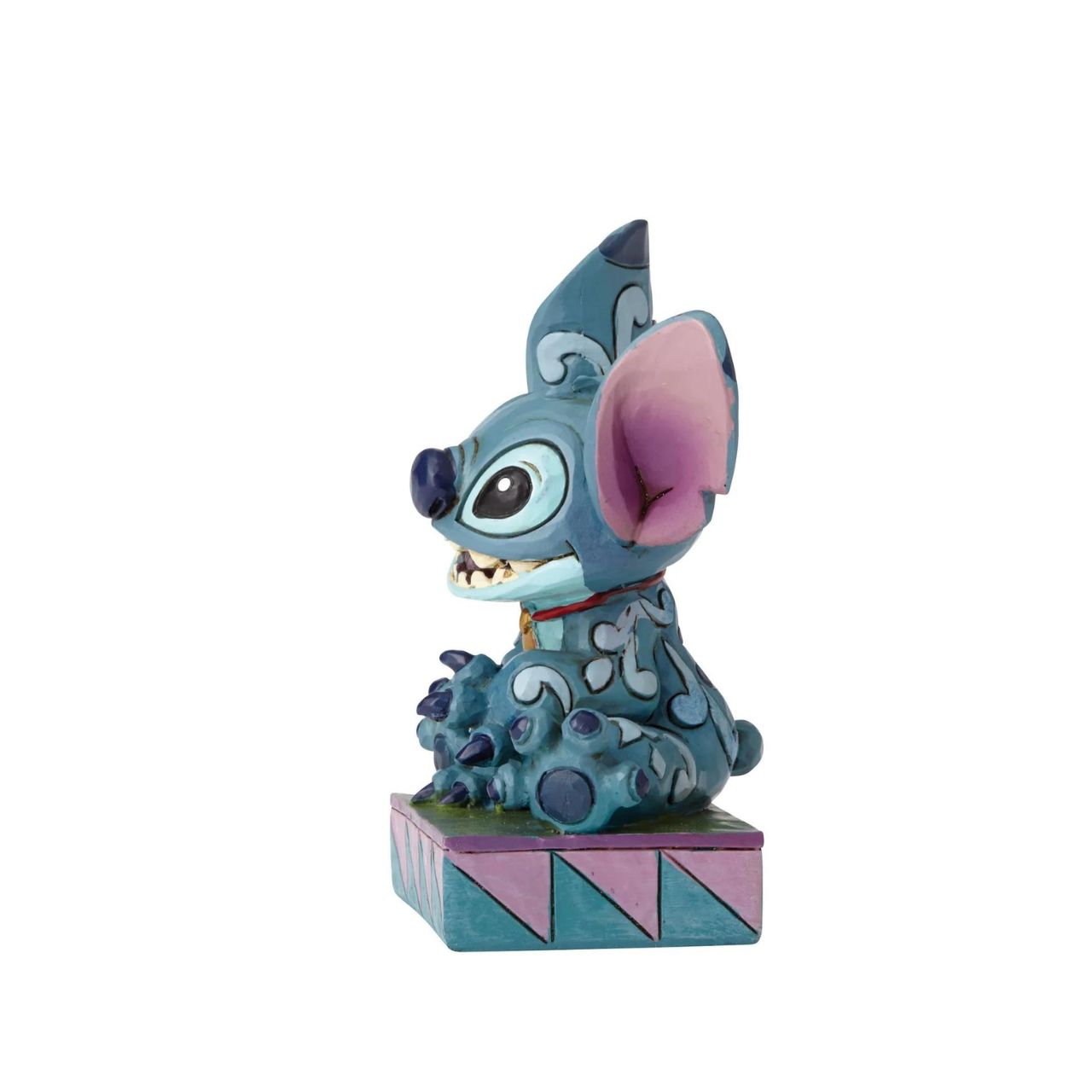 Disney Traditions Stitch Ohana Means Family  Designed by award winning artist and sculptor, Jim Shore for the Disney Traditions brand, this Stitch figurine is a part of a personality poses collection. He is featured displaying his typical mischievous smile.