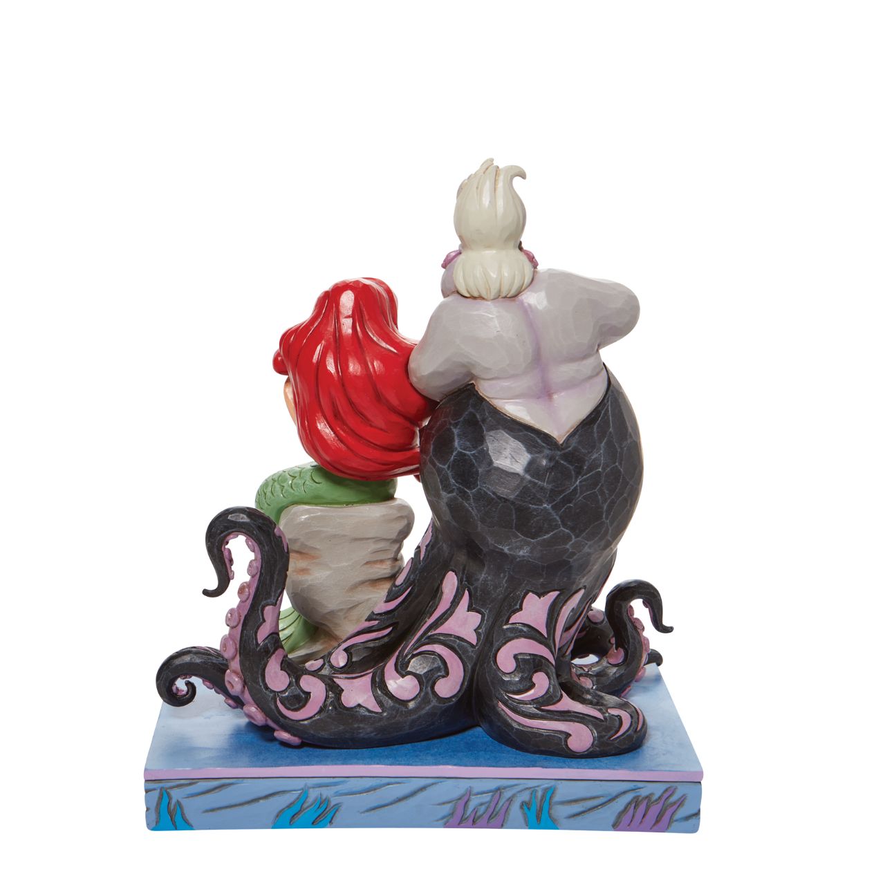 This Jim Shore piece ventures under the sea to share a scene of good and evil. Smiling innocently, Ariel, the little mermaid, sits on a stump as the sea witch, Ursula, connives cruelly behind her shoulder. Packaged in a branded gift box.