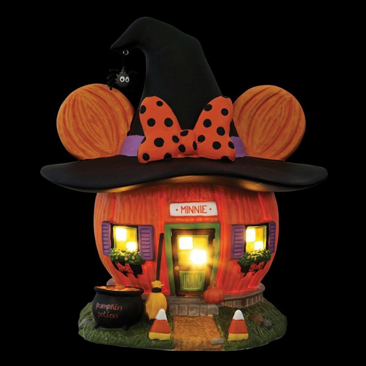 Wearing a jaunty witch's hat and her signature polka-dotted bow, Minnie's Pumpkin Town House is ready for the season!