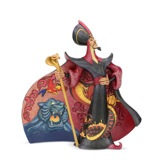 Disney Traditions Villainous Viper Jafar Figurine  Jafar, Aladdin's greatest threat, looks quite formidable in this Jim Shore design. His cloak billowing, etched designs make the villain even more threatening. With a snake twisted around his garment, and blue tiger bearing it's fangs, fear meets fashion.